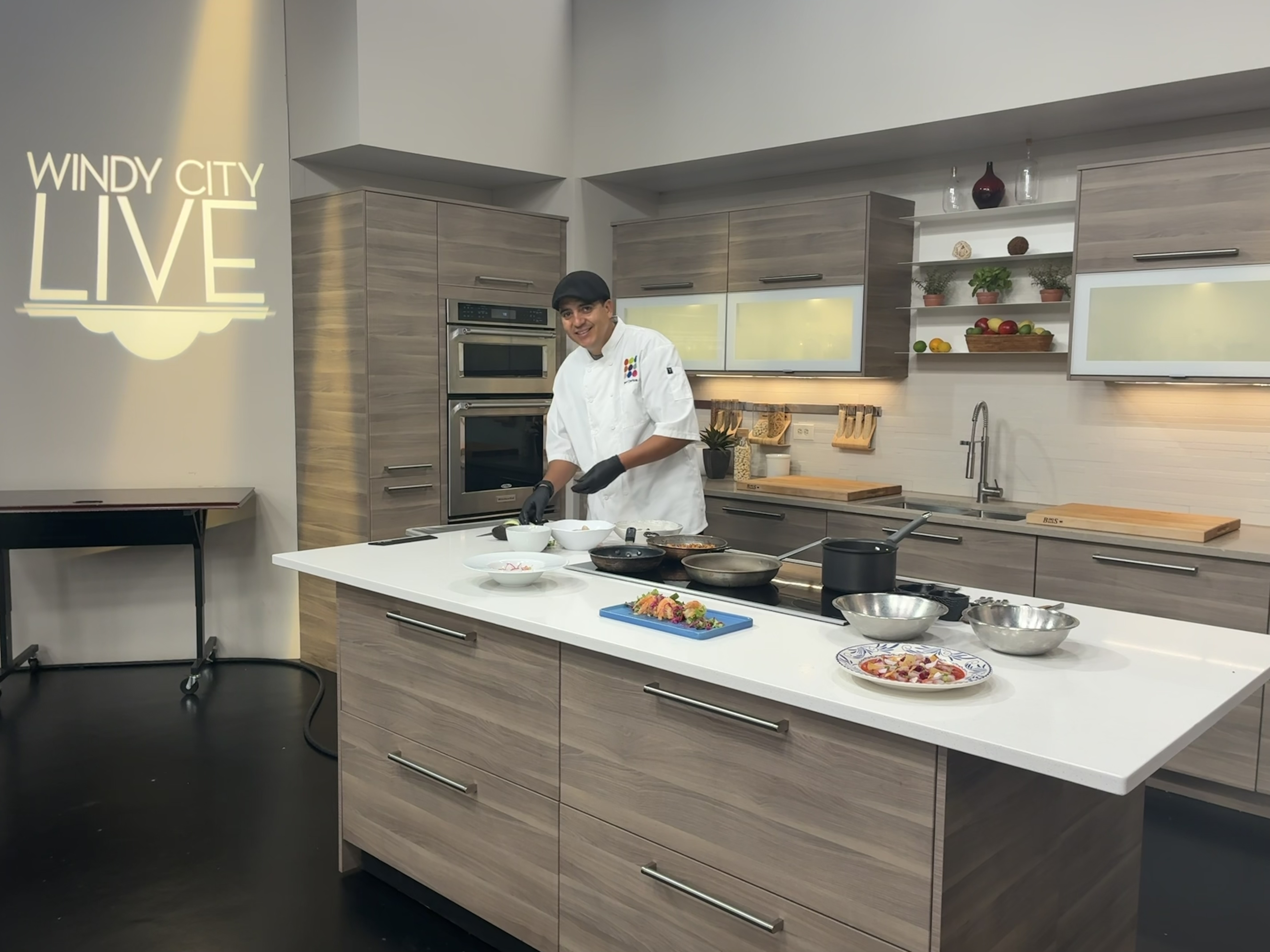 chef carlos at abc studio prepping seafood paella